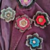 Crochet flower brooch with metal button