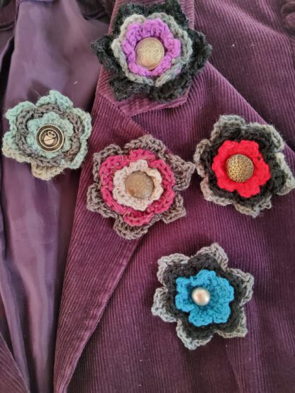 Crochet flower brooch with metal button