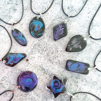 Galaxies in blue and purple resin pendant necklace