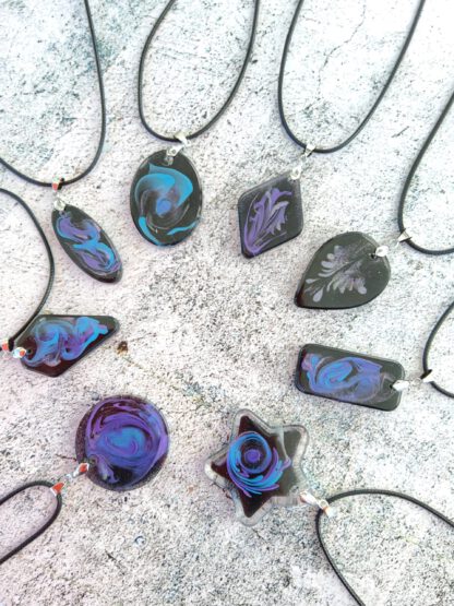 Galaxies in blue and purple resin pendant necklace